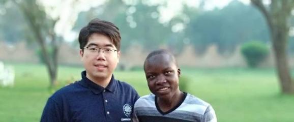 Bill Ding with a student from Makerere University in Uganda