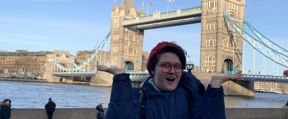 Talia Eshenbaugh poses in front of the Tower Bridge in London, England