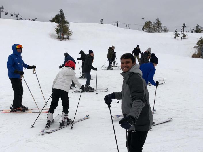 CWRU students in a ski lesson on a hill at Brandywine Ski Resort
