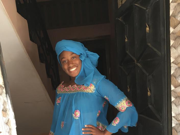 A CWRU student stands in a doorway during her study abroad experience