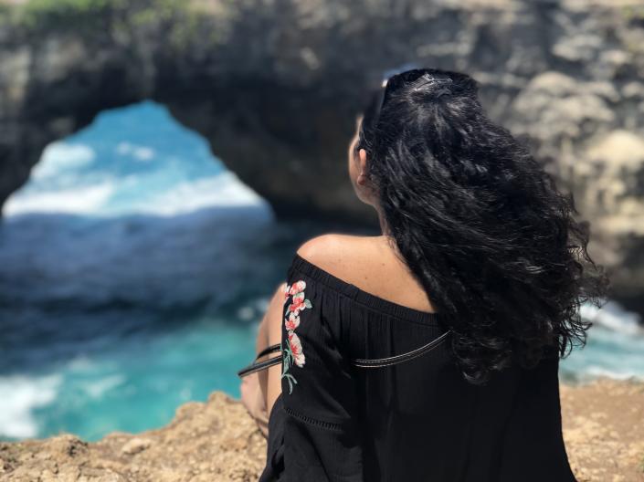 student facing the ocean