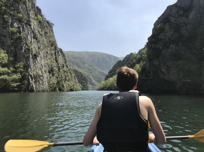 student kayaking abroad