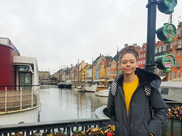 Katie Brown stands on a bridge covered with locks