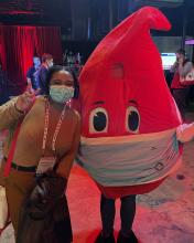 NaShea Kendrick posing with stuffed blood mascot