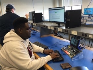 Student working with Edge device in classroom