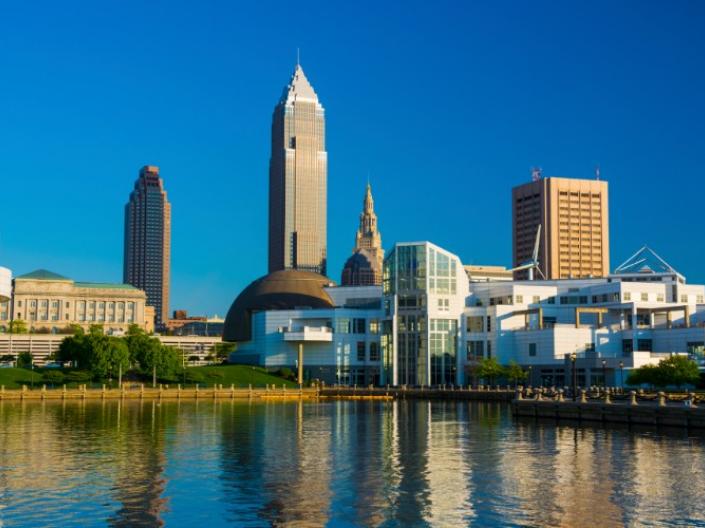 The city of Cleveland overlooking a river 