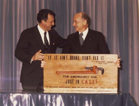 David Ragone receives gag gift at inauguration gala dinner, 11/1980