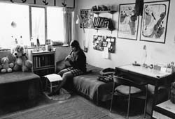 woman playing flute in dorm room