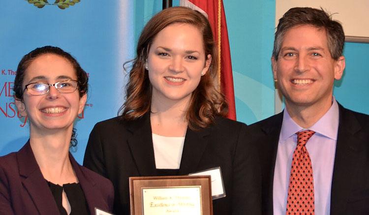 Emily Cunningham (center) is pictured with Adrienne Kirshner, an associate at Tucker Ellis, and Michael J. Borden, Associate Dean for Administration and Associate Professor at Cleveland-Marshall College of Law.