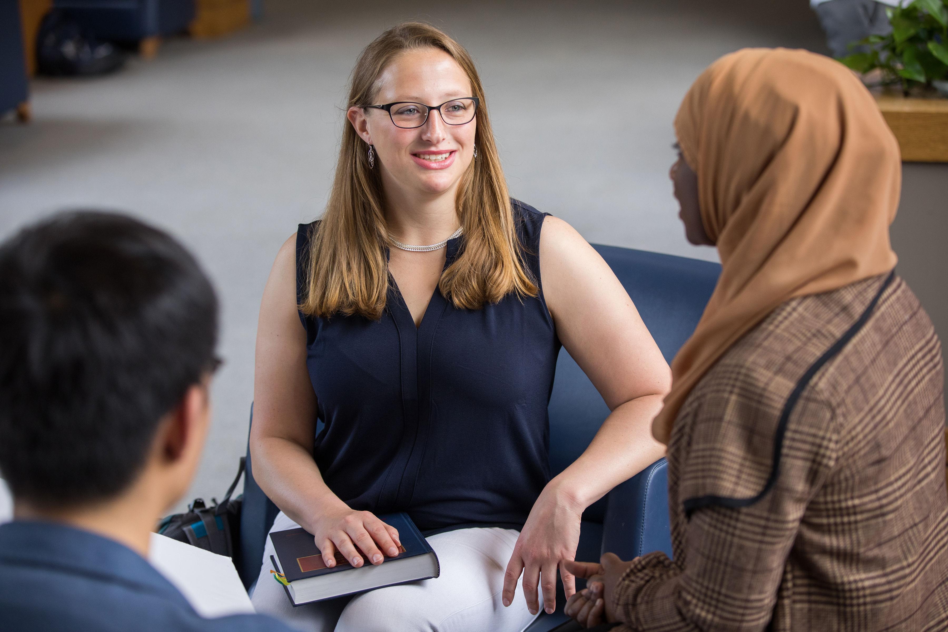 Photo of a law student interviewing a client