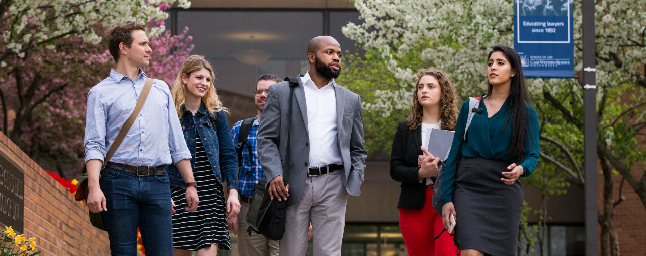 Students walking outside of the Law School Building