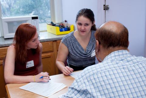 A CWRU Law student working with a client
