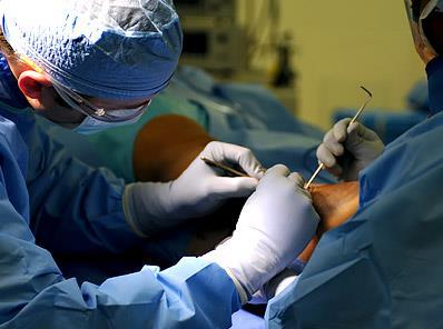 Physicians operating on a patient