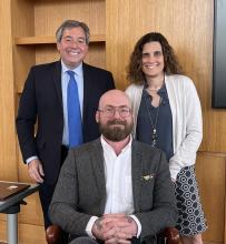 Professor Aaron Perzanowski (seated) with Co-Deans Michael Scharf and Jessica Berg