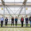Students and professor lined up for photo inside Greenhouse Growers