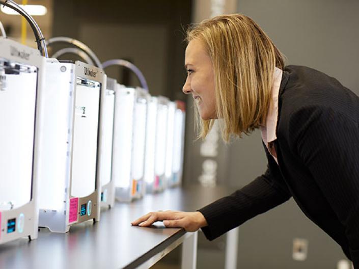 CWRU Law student looking 3-D printers