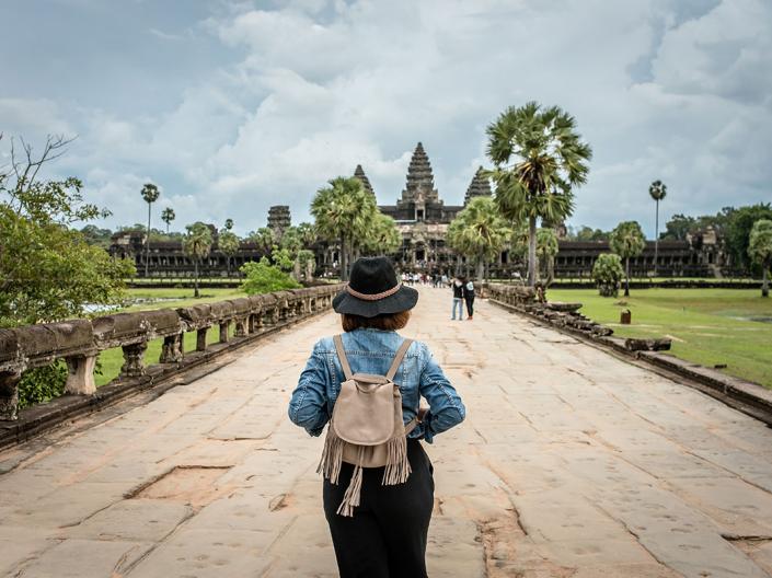 A CWRU law student walking in Cambodia