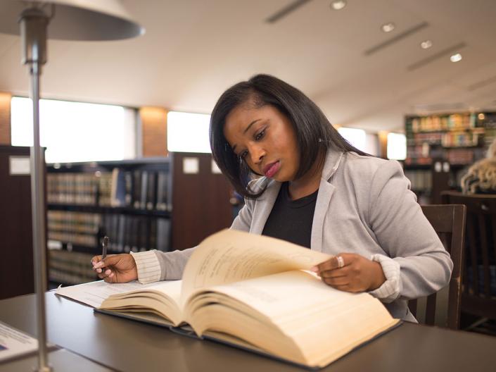 A Law Masters student at Case Western Reserve University studying in the library