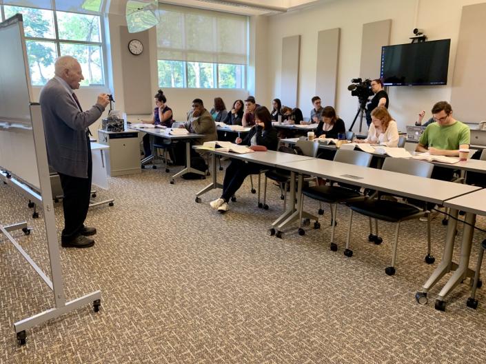 Professor Leon Gabinet teaching a tax law class.