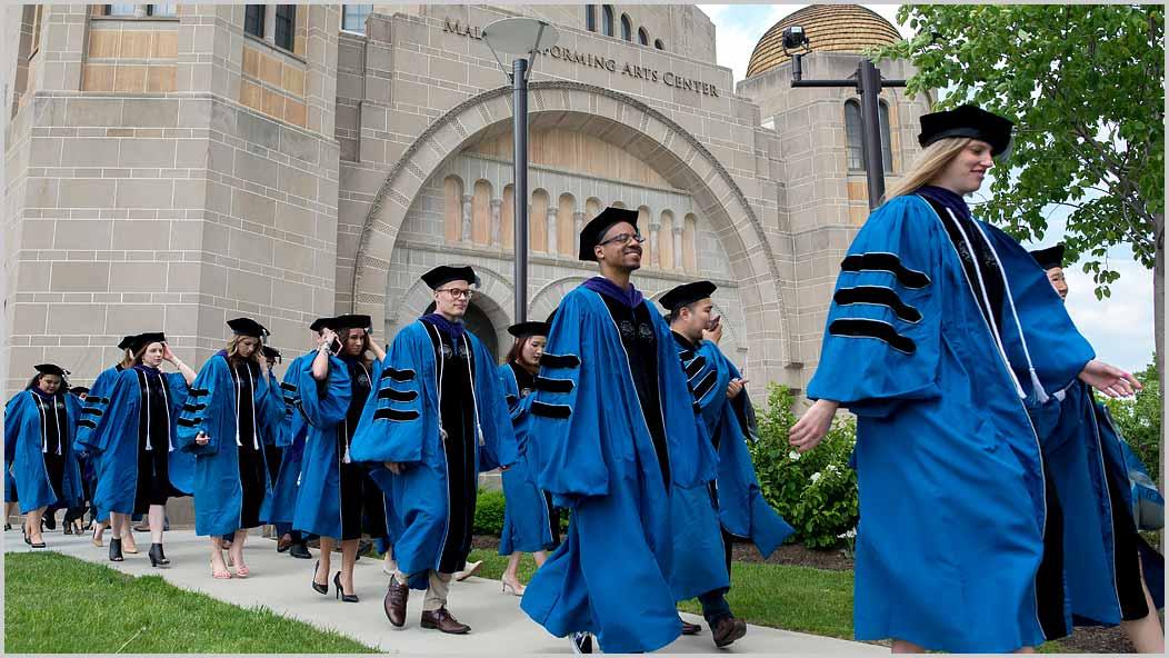 Students walking to 2019 Commencement ceremony in from of Maltz Performing Arts Center