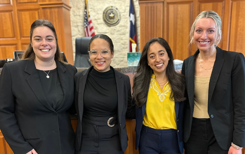 Students Clare Kelley, Kelsey Moore, Michaella Polverini and Ryn Wayman in a courtroom