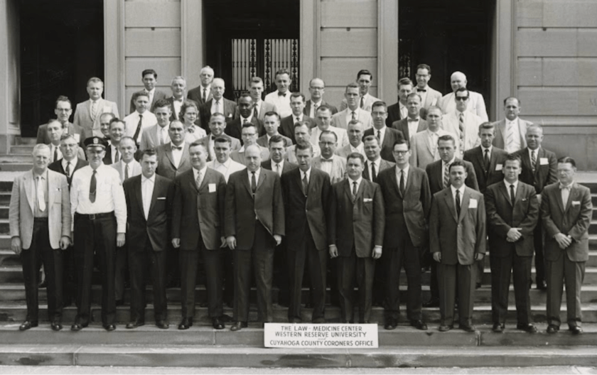 Dated photograph of the founding members of the Law-Medicine Center standing outside the Cuyahoga County Coroners office