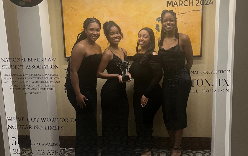 BLSA Mock Trial Winners 2024 pictured in the hotel holding their trophy