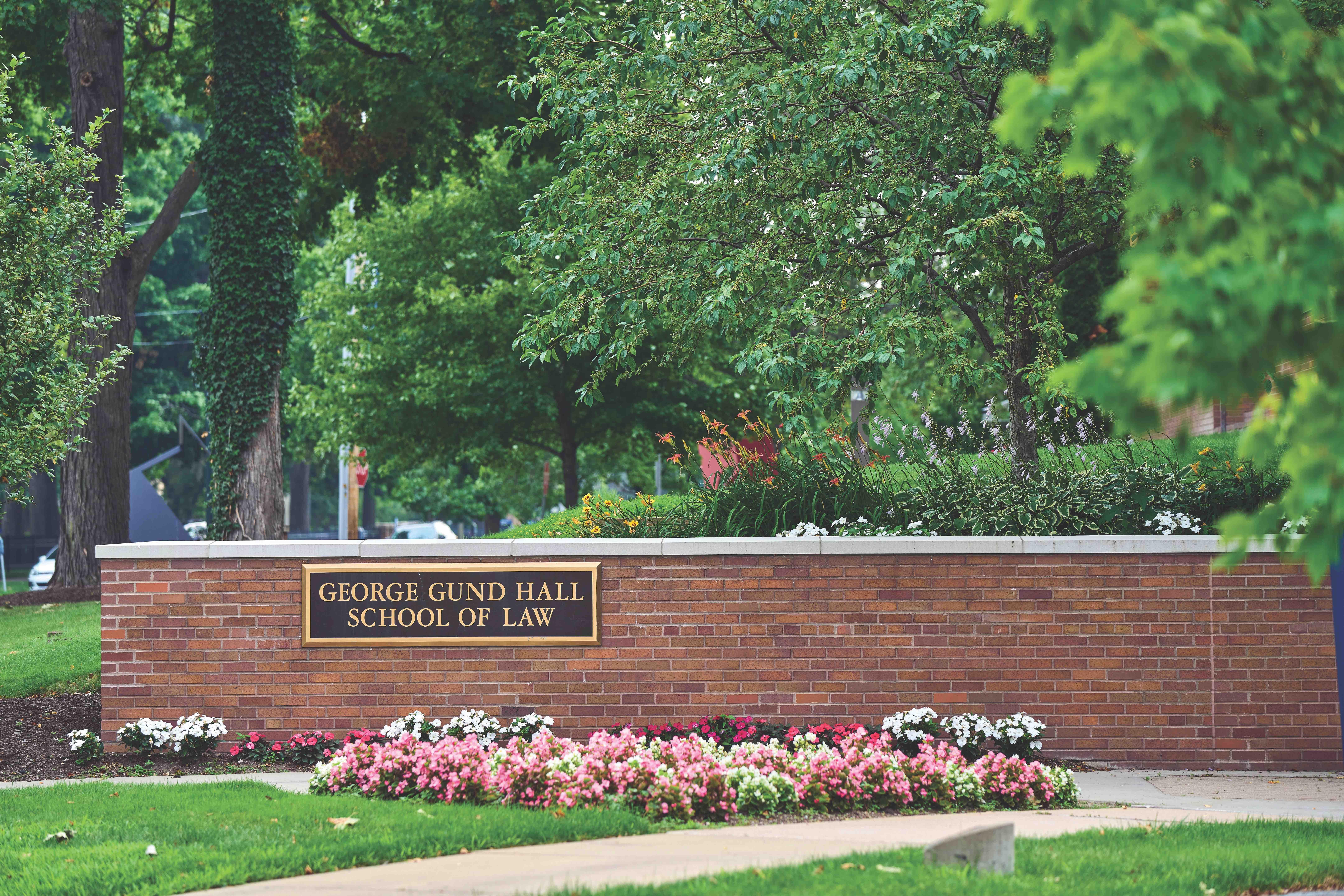 Outside shot of the law school showing the "George Gund Hall School of Law" sign