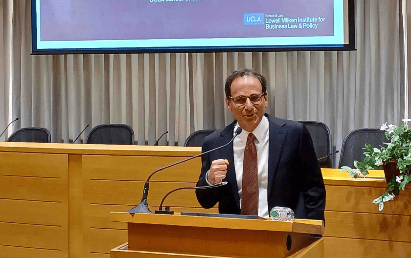 Michael Dorff behind the podium presenting in the Moot Courtroom