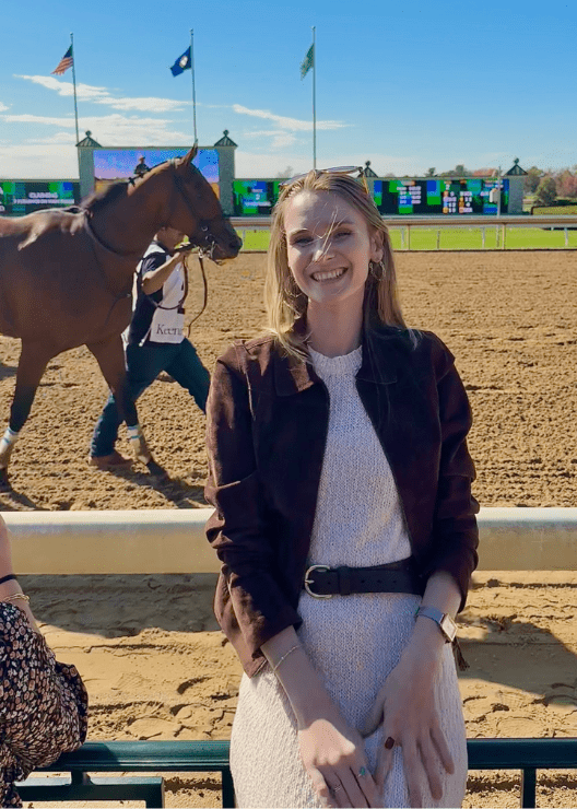 Jilly Fox at an equestrian event, smiling at the camera