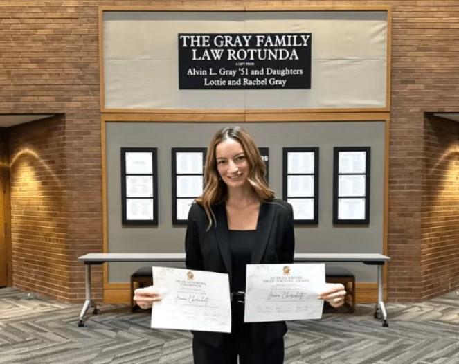 Jenna Chirichetti in the Upper Rotunda with her certificates