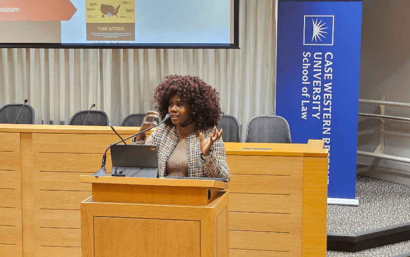 Conner standing in the Moot Courtroom during the presentation