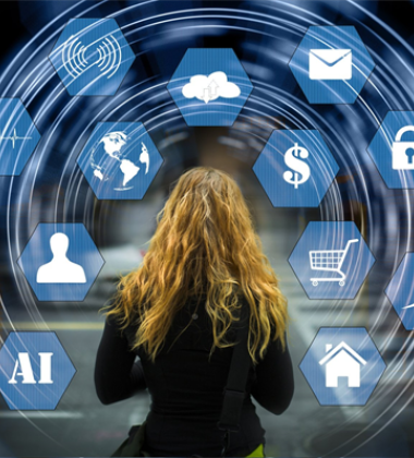 Person standing in front of a circle of computer icons