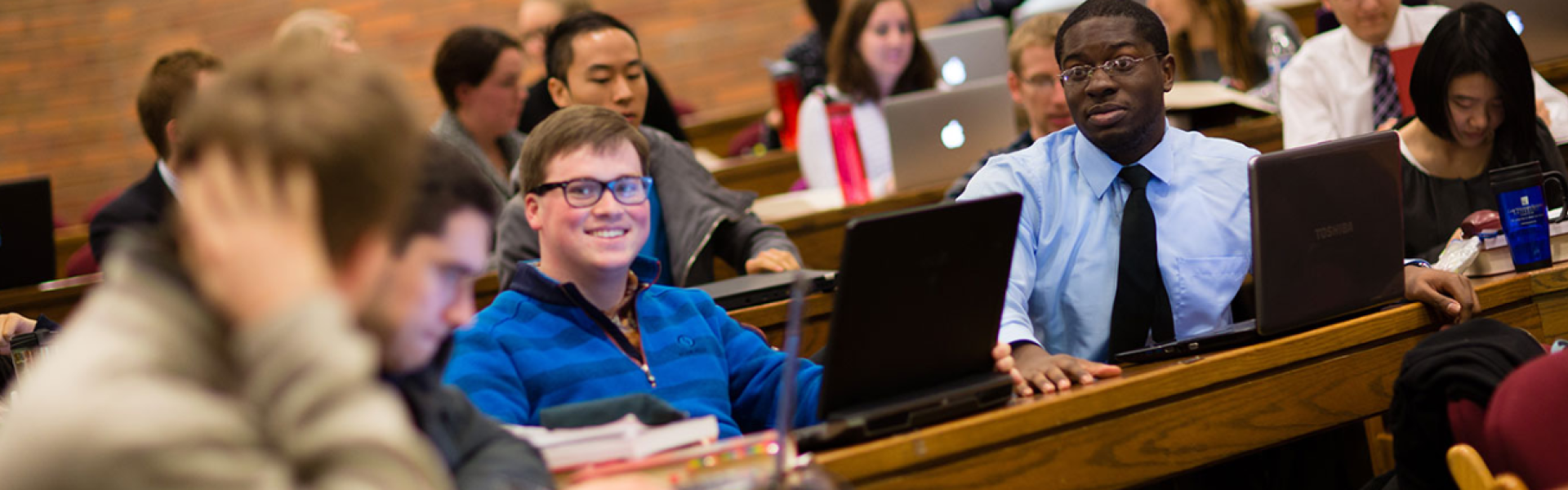 CWRU Law students talking in class together