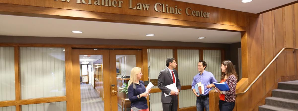 faculty and staff consulting out the Milton A. Kramer Law Clinic Center
