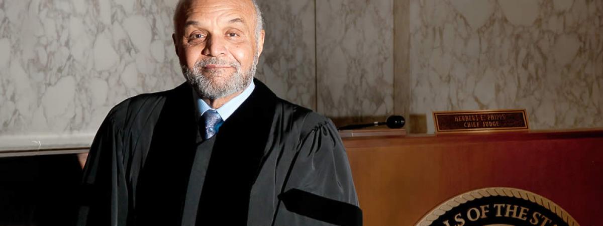 image of judge in robe in front of his bench