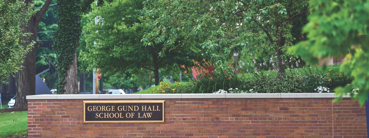 Outside shot of the law school showing the "George Gund Hall School of Law" sign