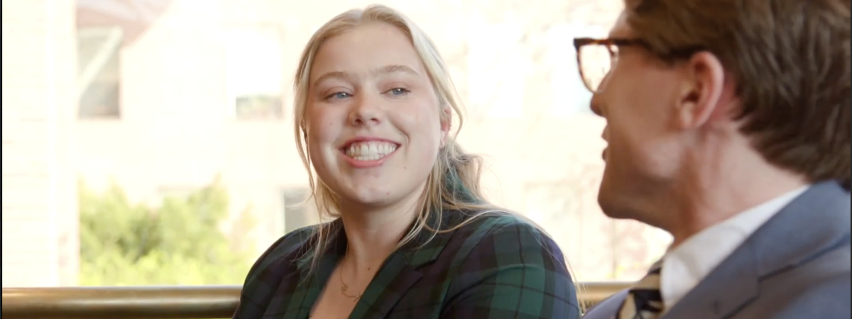 Student talking with professor