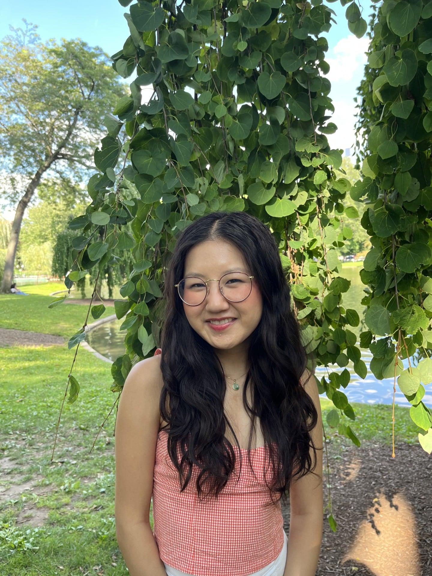 Clare Soria photo taken outside in front of greenery