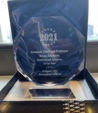 Photo of the Institutional Advocate award presented to Professor Adamson