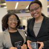 Photo of Sierra Lipscomb and Makela Hayford holding awards.