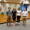 Photo of four Case Western Reserve University law students standing in a courtroom