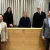 Trevin Crider and Yuqi Sun in the moot courtroom with the competition judges behind them