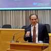 Michael Dorff behind the podium presenting in the Moot Courtroom