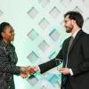 Daniel Leizerman (right) shaking hands with a Legal Aid representative as he accepts his award