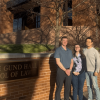 Patent Application team outside of the law school in front of the sign reading "George Gund Hall" 