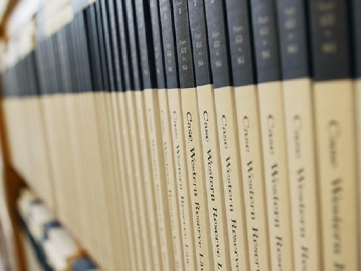 image of case western reserve law journal shelved in a long row in a library setting