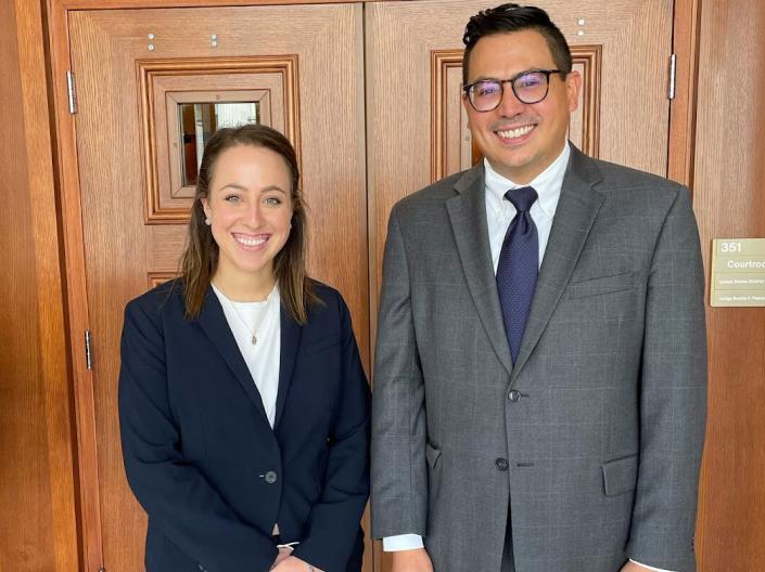 Senior Fellow Sara Coulter and Director Andy Geronimo standing in front of the Thomas D. Lambros Federal Building and U.S. Courthouse in Youngstown, Ohio, after a multi-day federal bench trial chaired by Certified Legal Externs.
