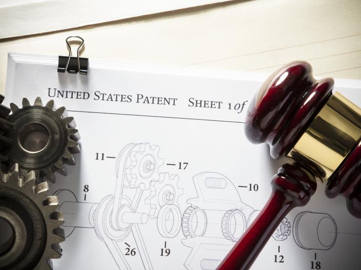 US patent form with gavel and gears