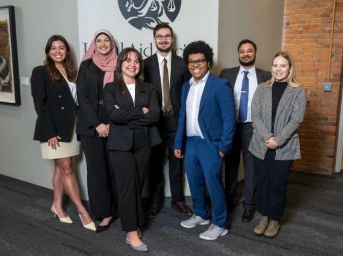 Seven of Legal Aid's Summer Associates posing for a group photo, including the five CWRU Law students